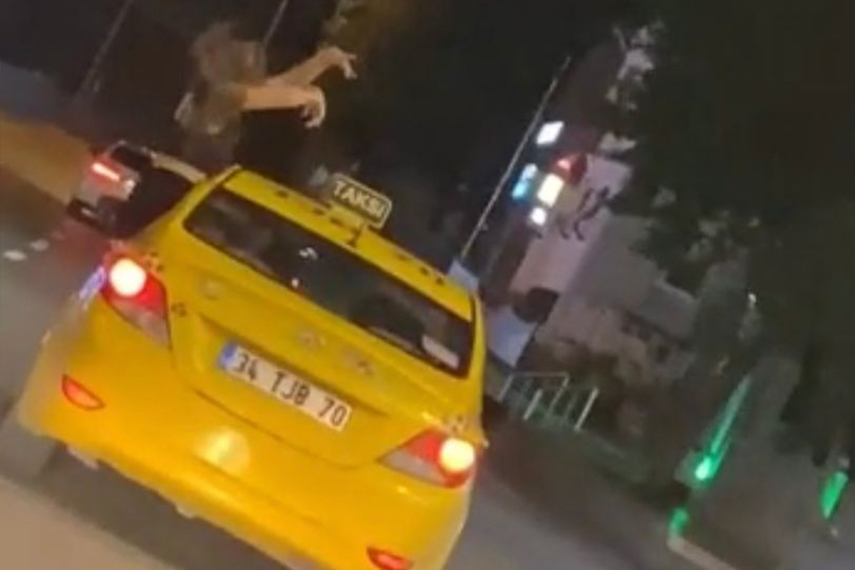 Kadıköy’de genç kadının taksinin camından dışarı çıkarak dans ettiği anlar kamerada